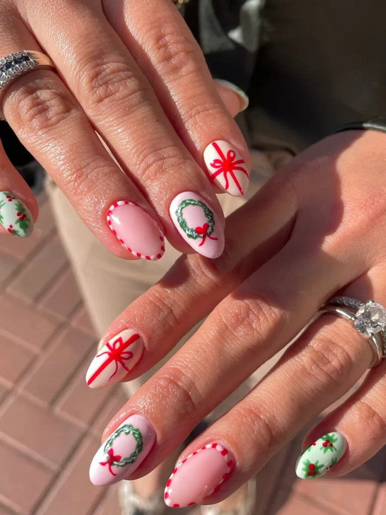 cute christmas nails with red bows wreath art dotted borders and holly details