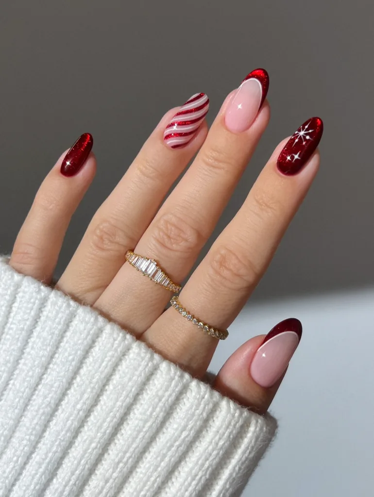 red glitter christmas nails with candy cane stripes pink accents and star details