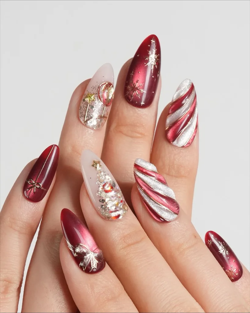 red chrome christmas nails with metallic silver swirls gold accents and festive tree design
