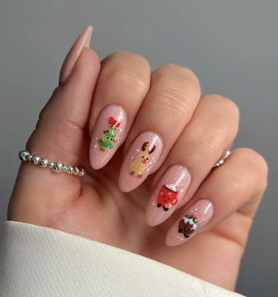 cute christmas nails with tiny tree reindeer mug and pudding characters on sparkly pink base