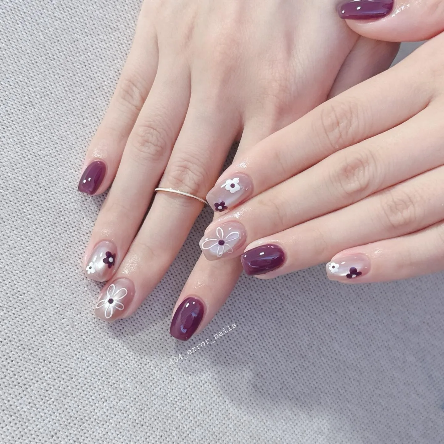 burgundy oval floral daisy nails