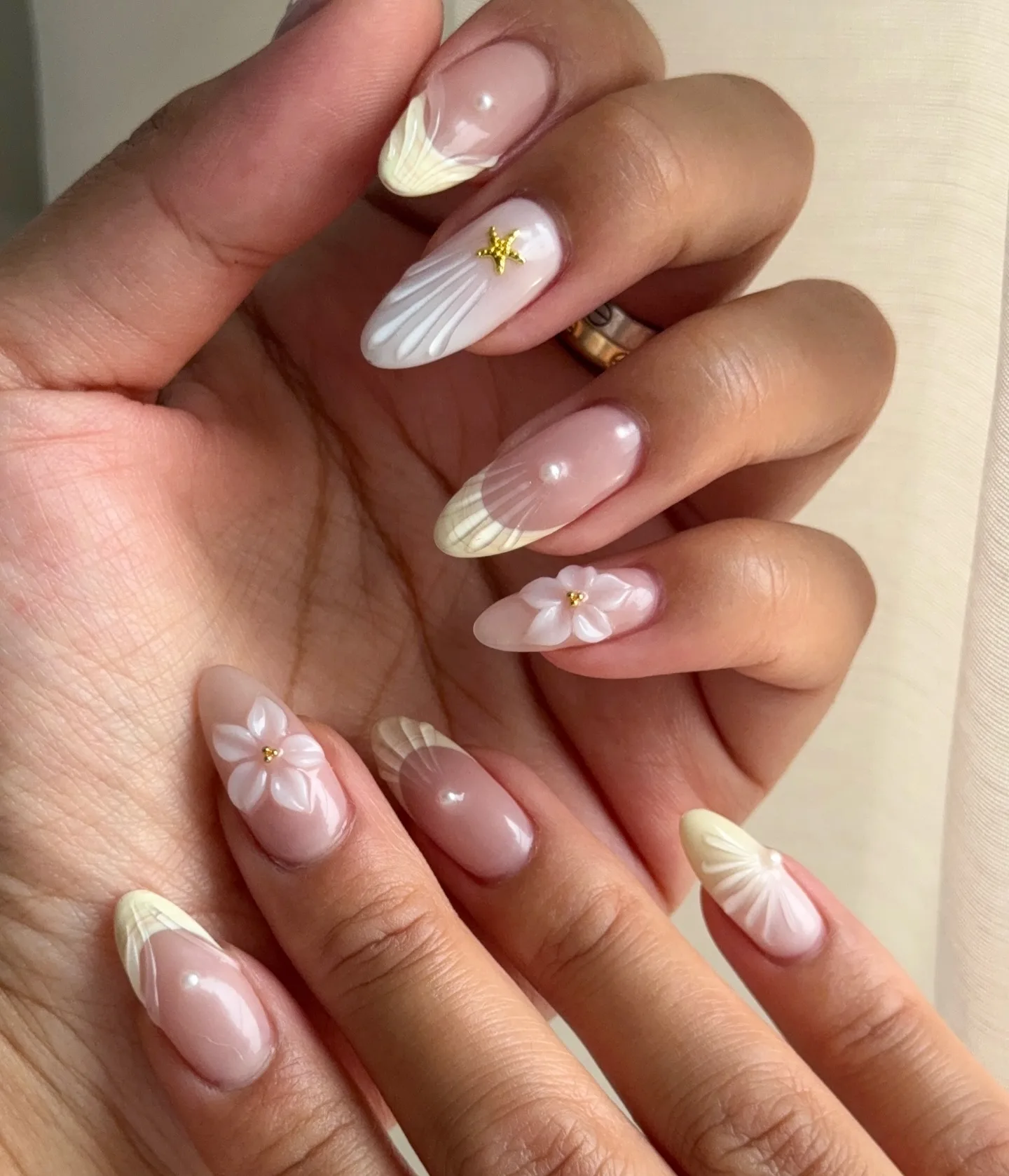 nude pink almond shell design nails