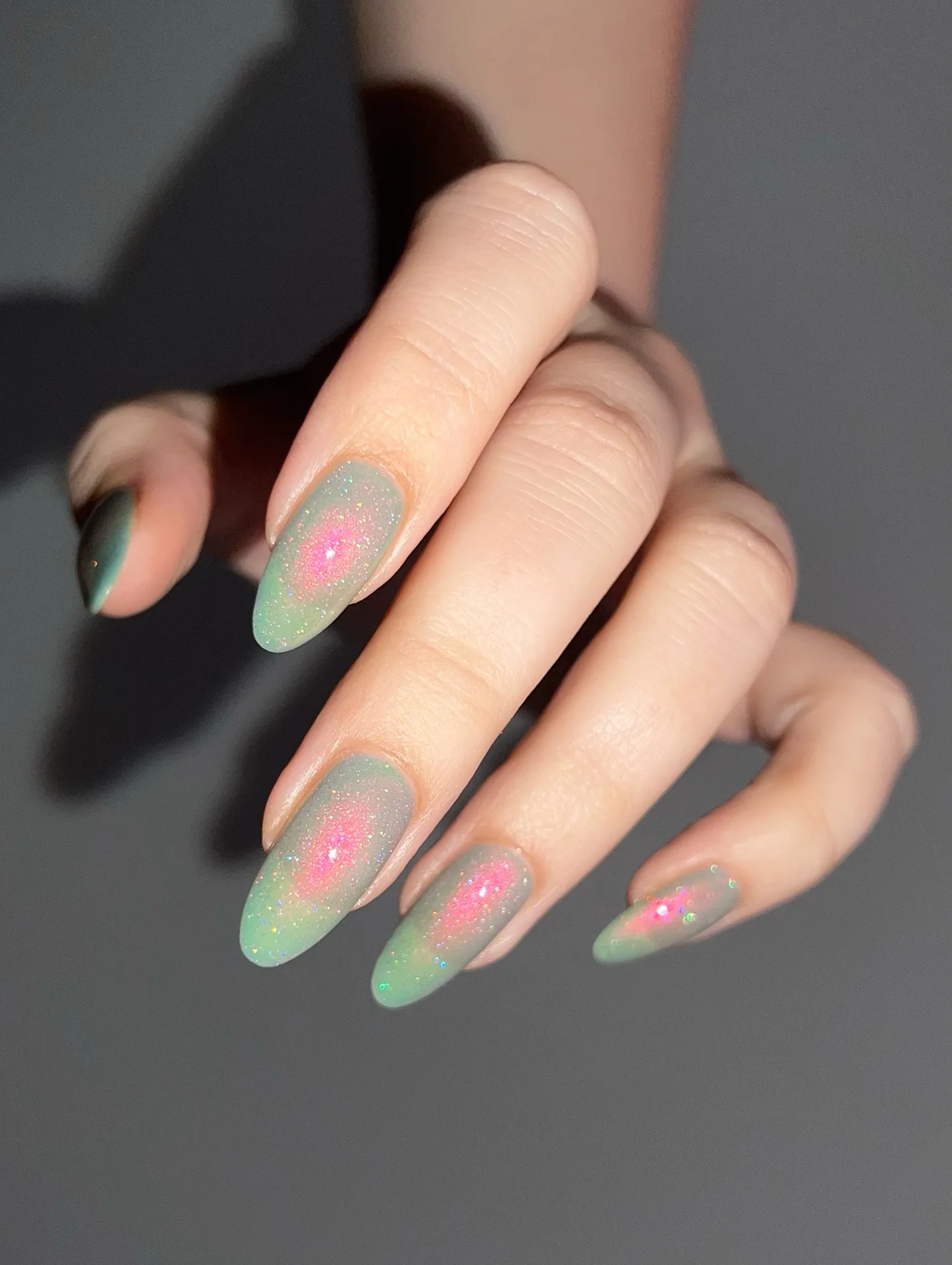 mint green oval holographic chrome nails