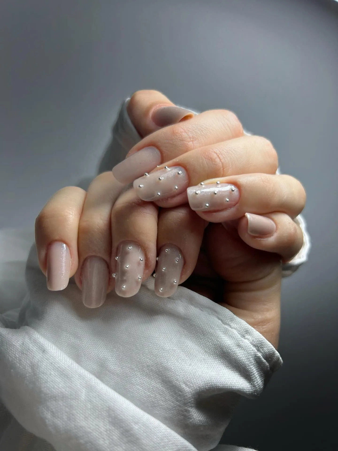 nude pink oval rhinestone nails