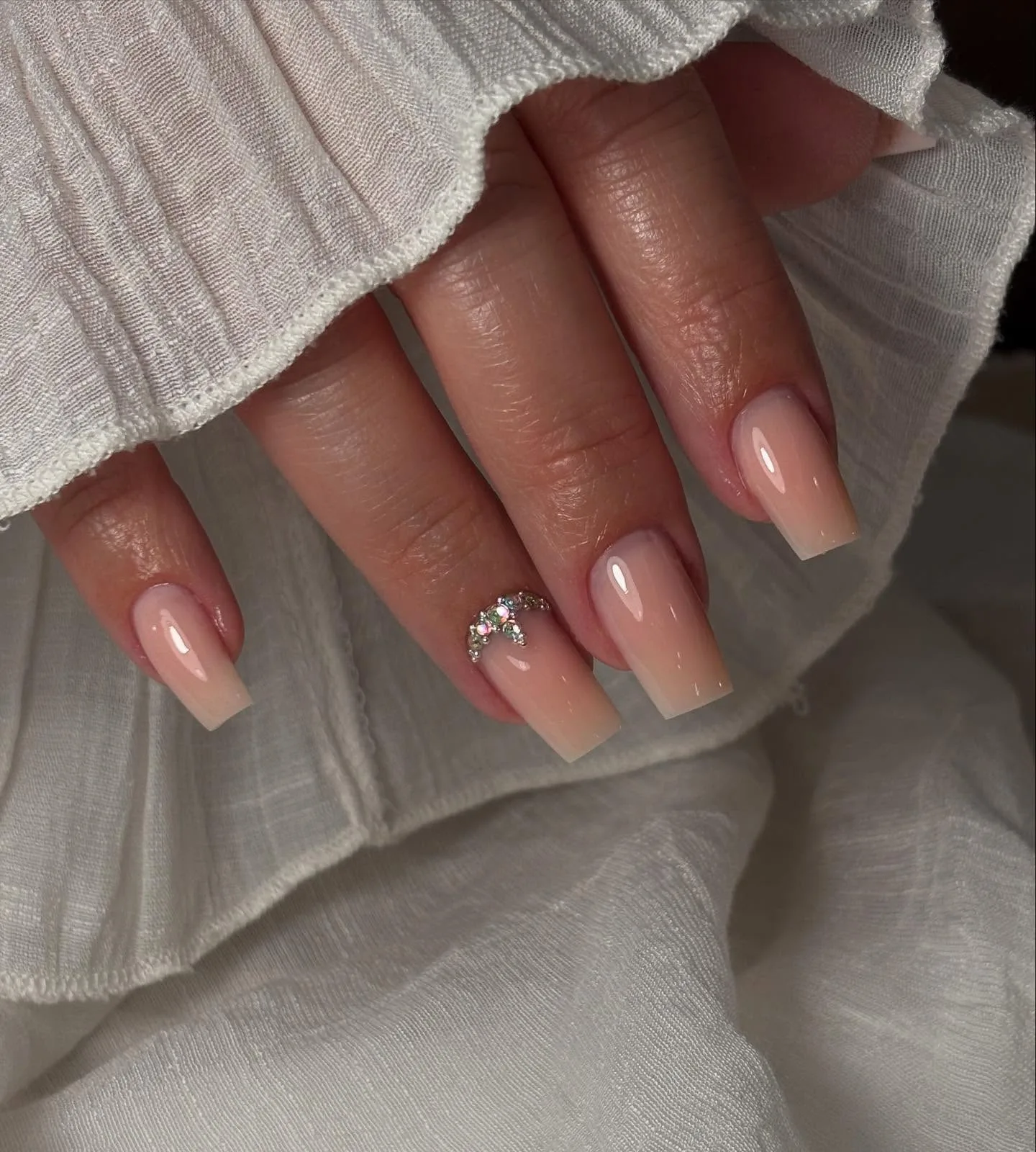 peachy nude coffin crystal bow nails
