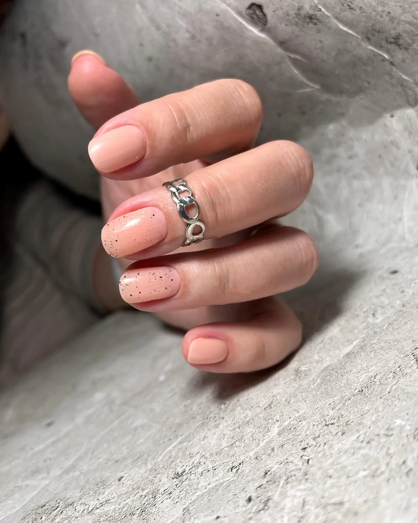 peachy pink oval speckled nails