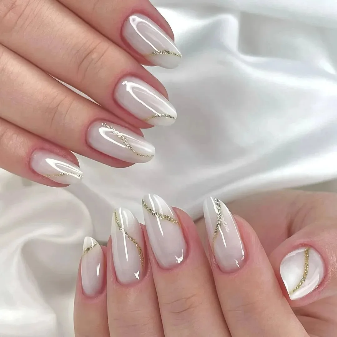white almond gold accent nails