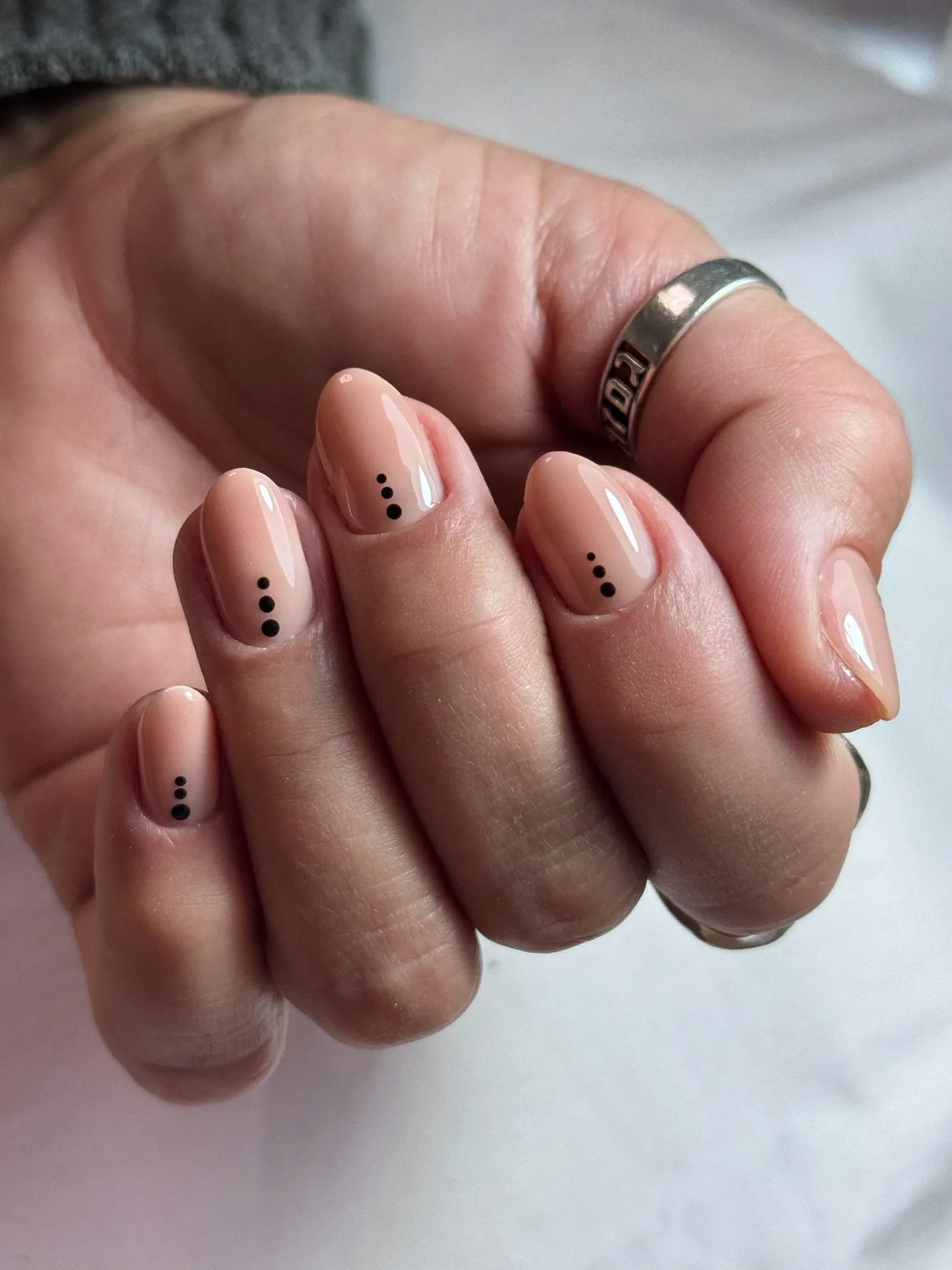 nude pink almond dotted nails