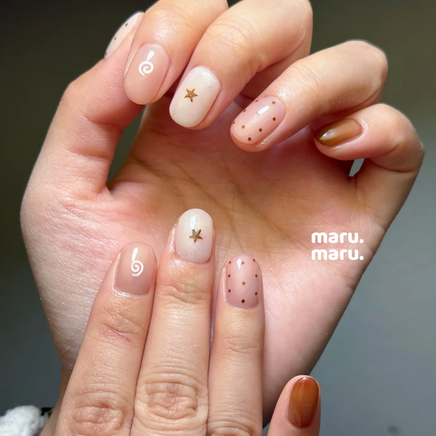 nude pink oval mixed design nails