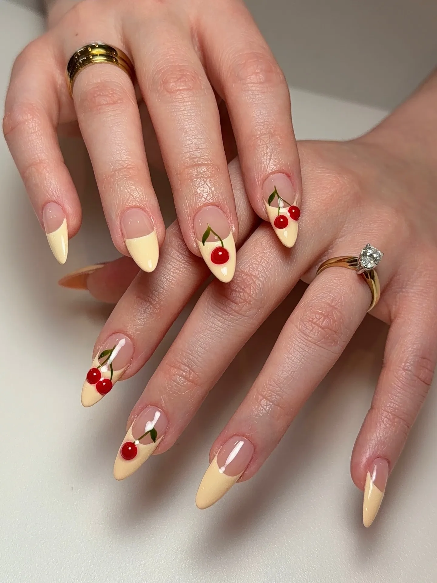 peachy almond cherry design nails