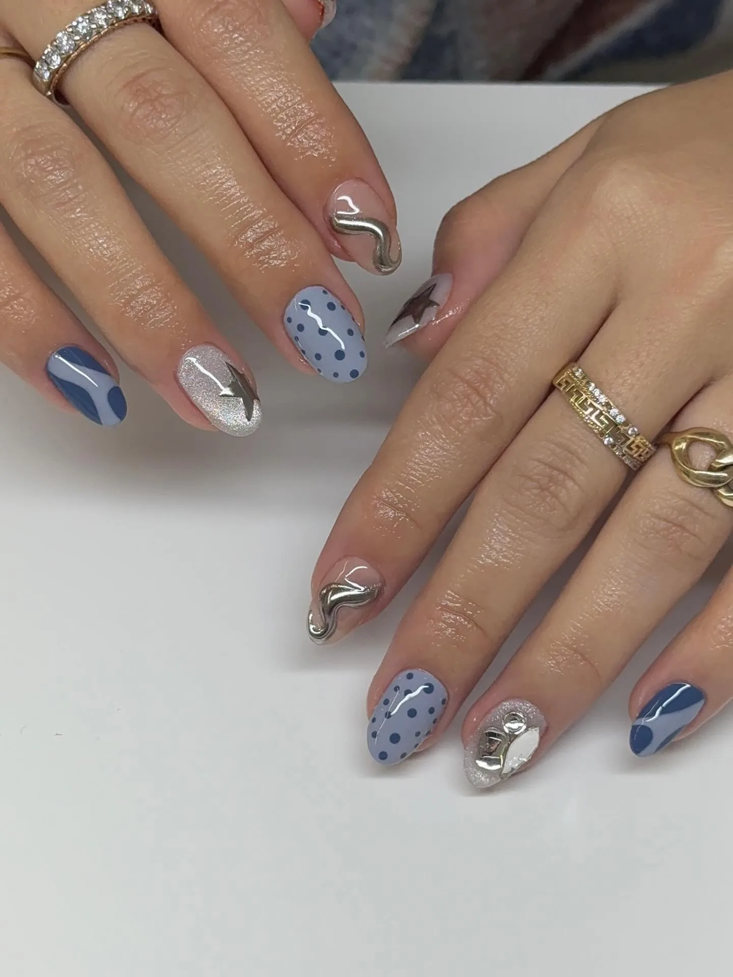 blue almond mixed design nails