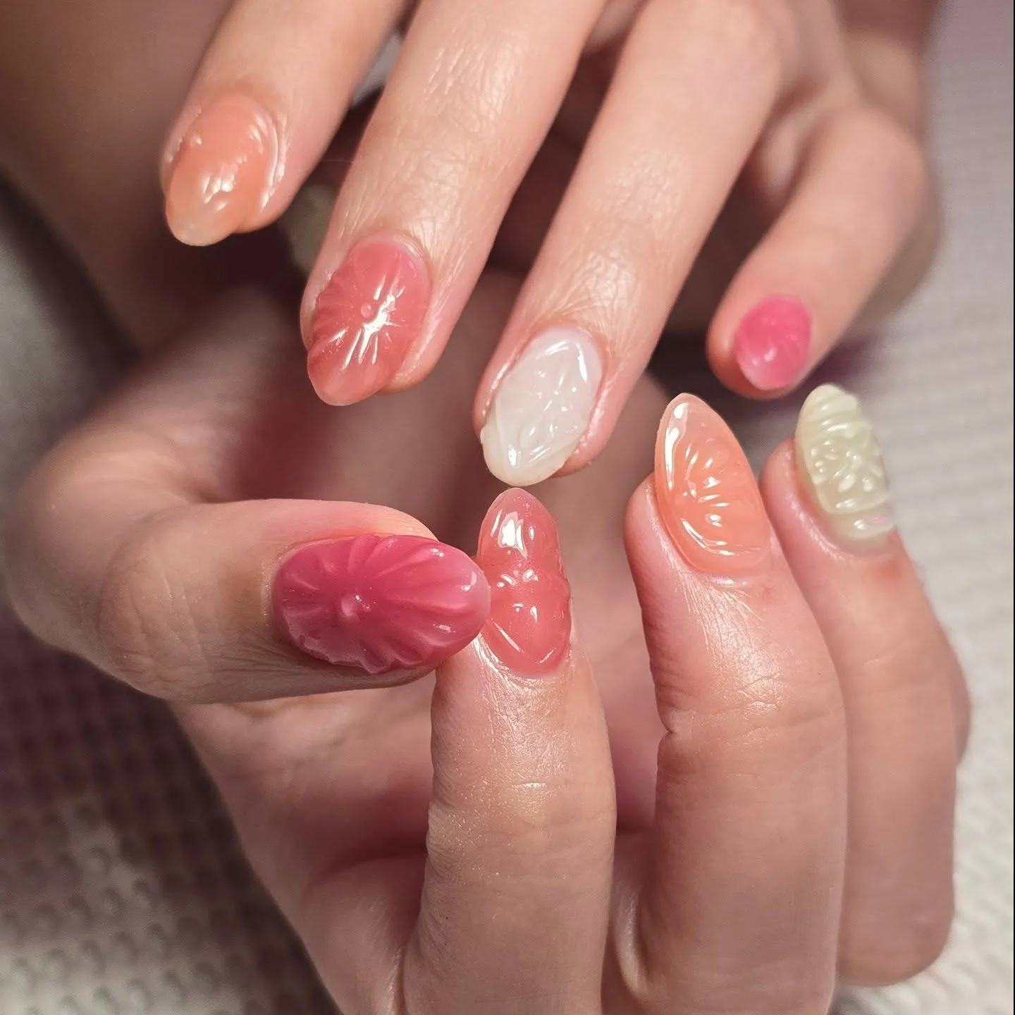 coral oval citrus design nails