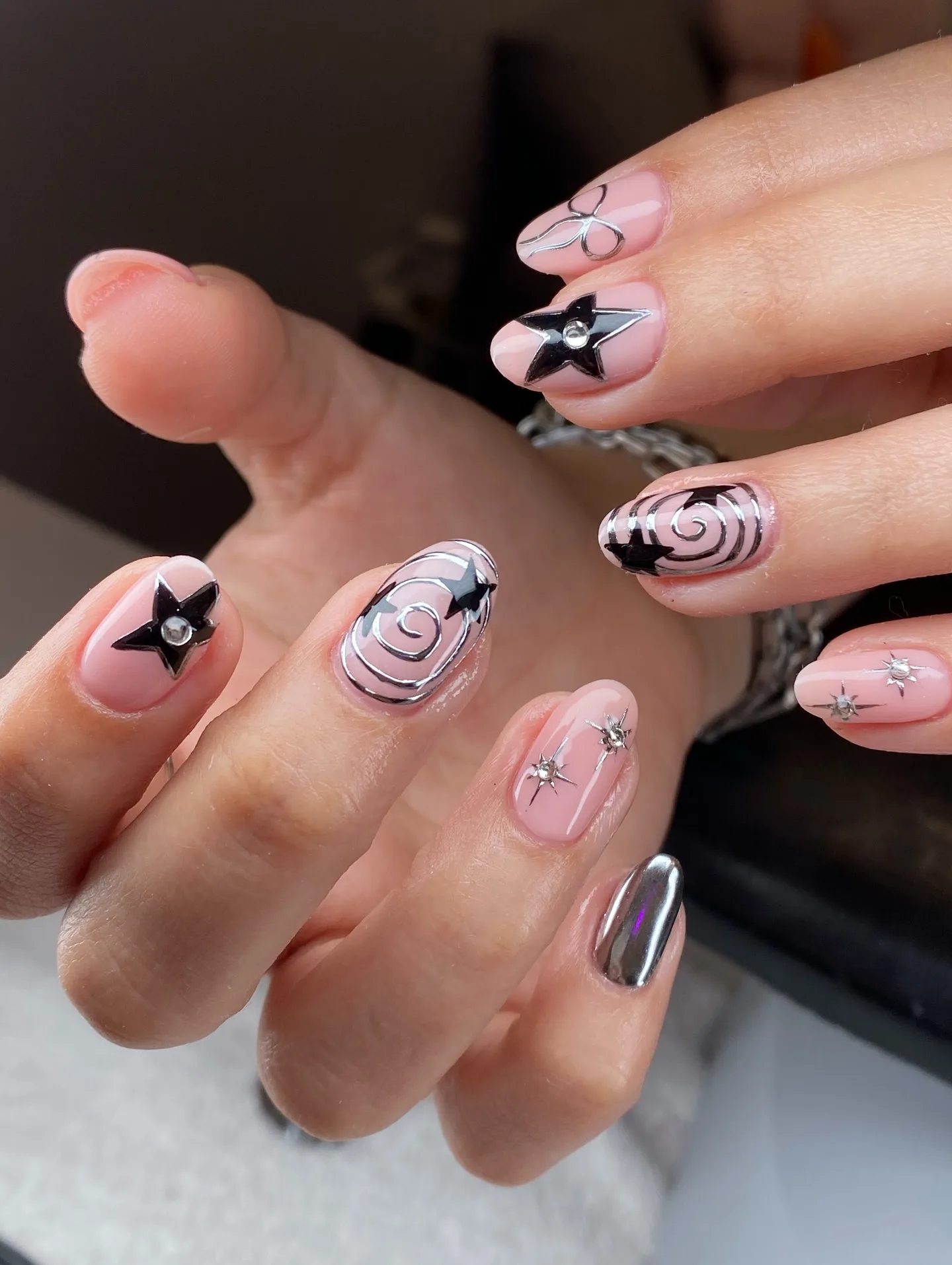 pink almond black design nails
