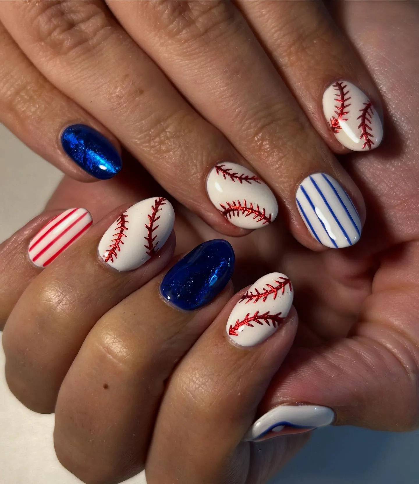 white blue oval baseball nails