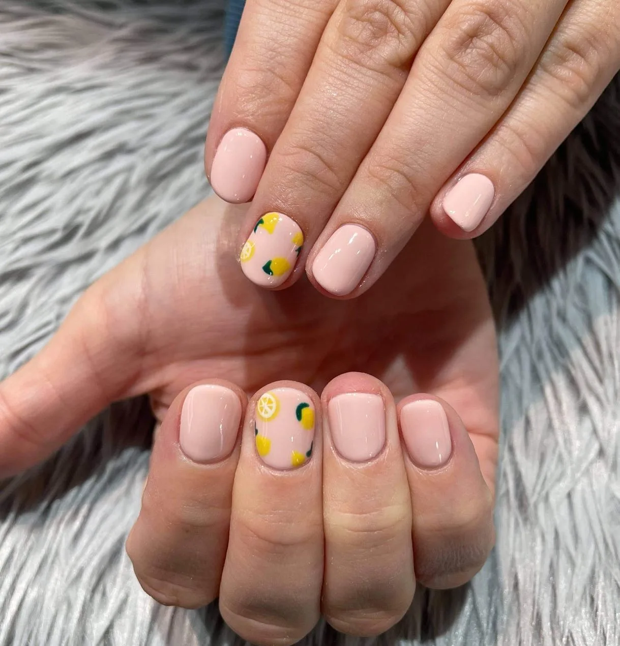 peachy pink rounded lemon nails