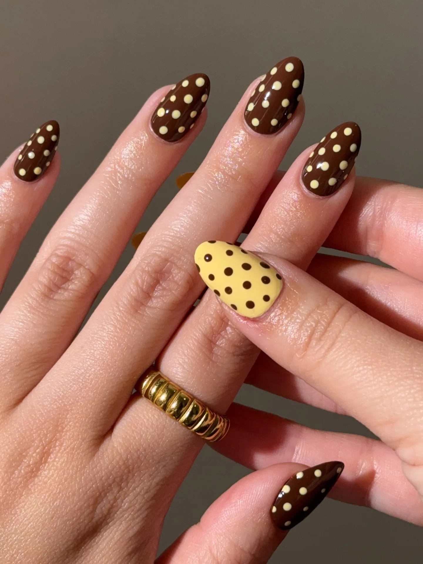brown almond polka dot nails