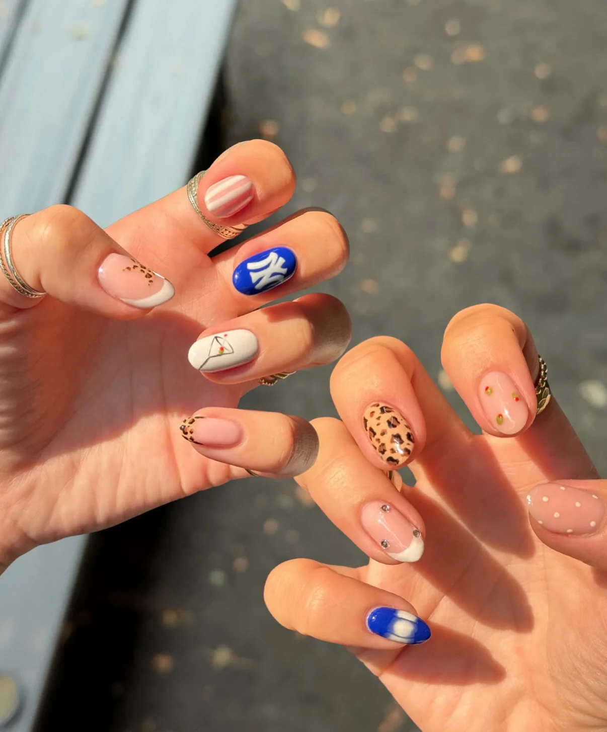 nude oval mixed design nails