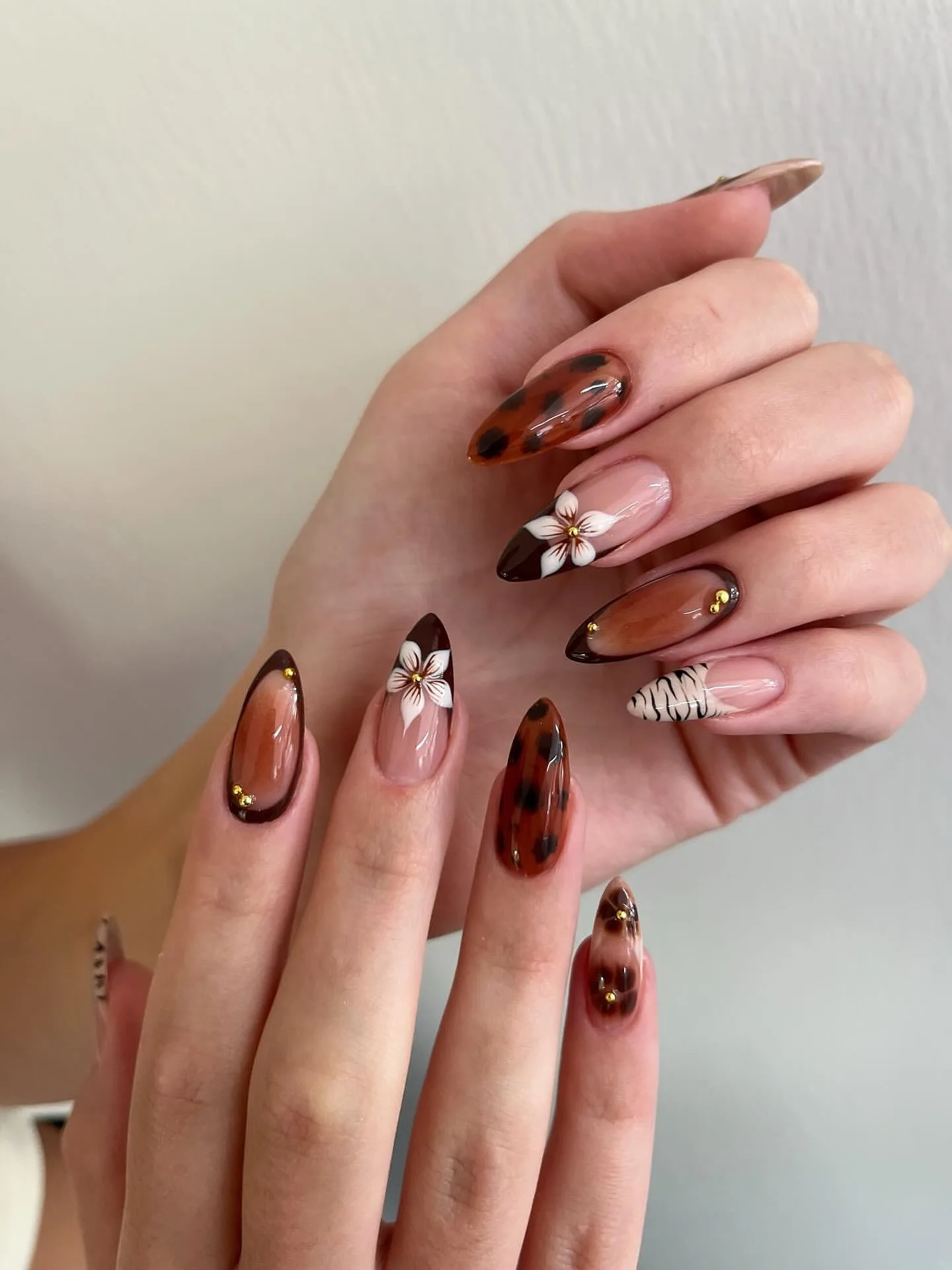 amber tortoiseshell almond floral nails