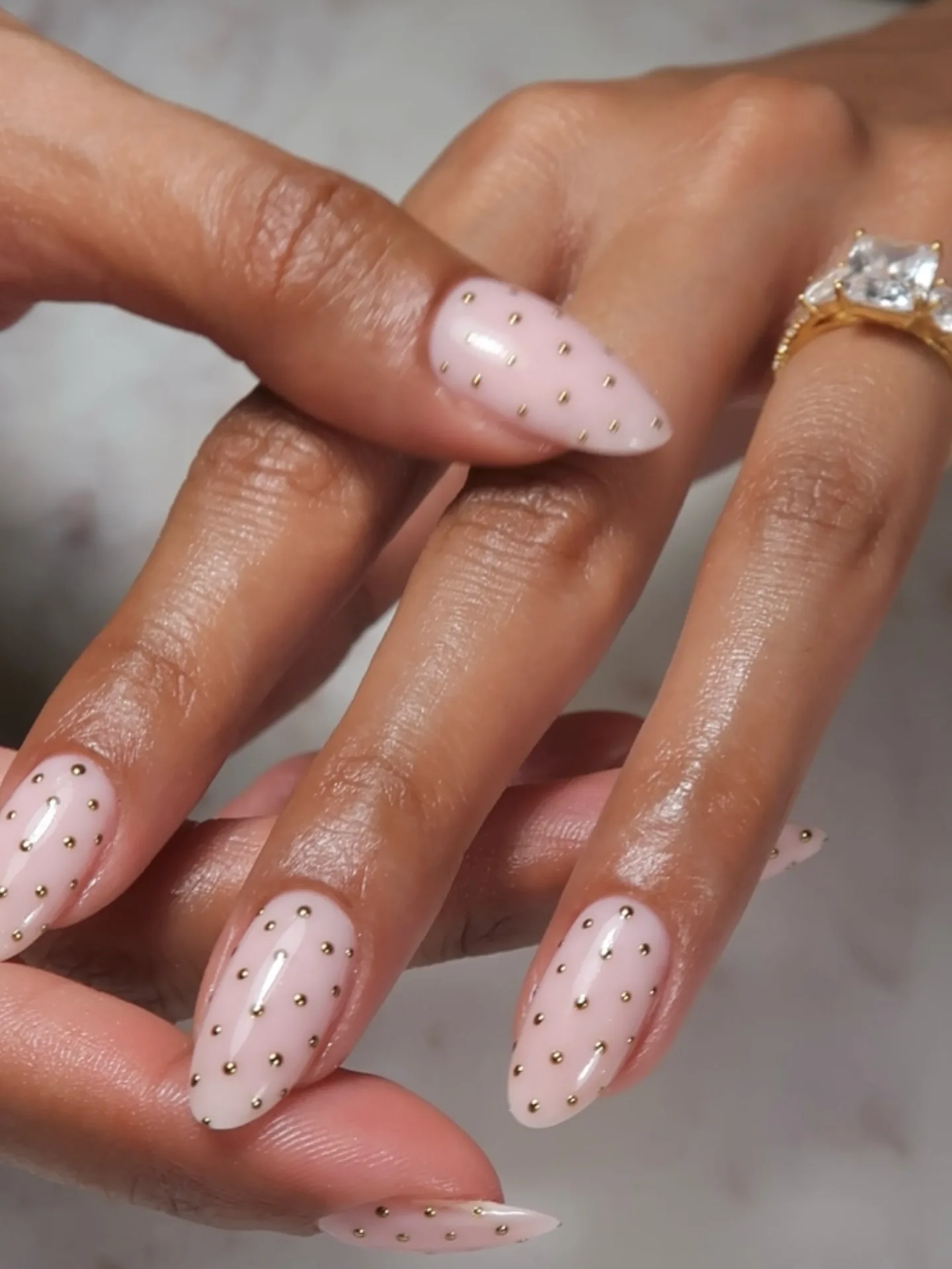 milky pink almond studded nails