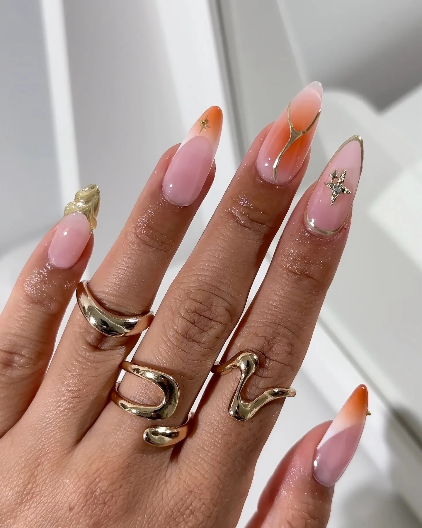 dusty rose almond glossy nails