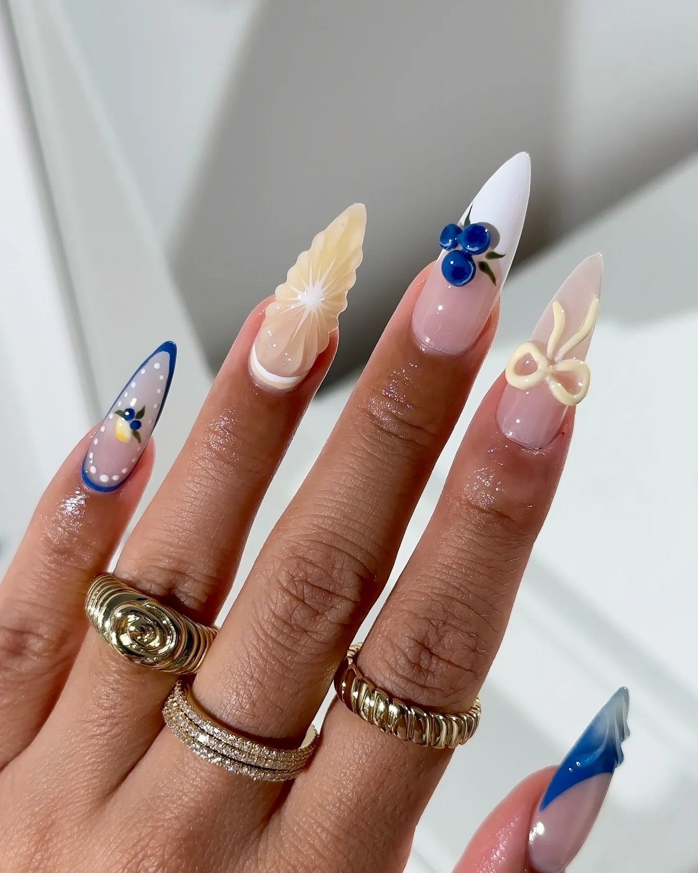 blue yellow stiletto lemon nails