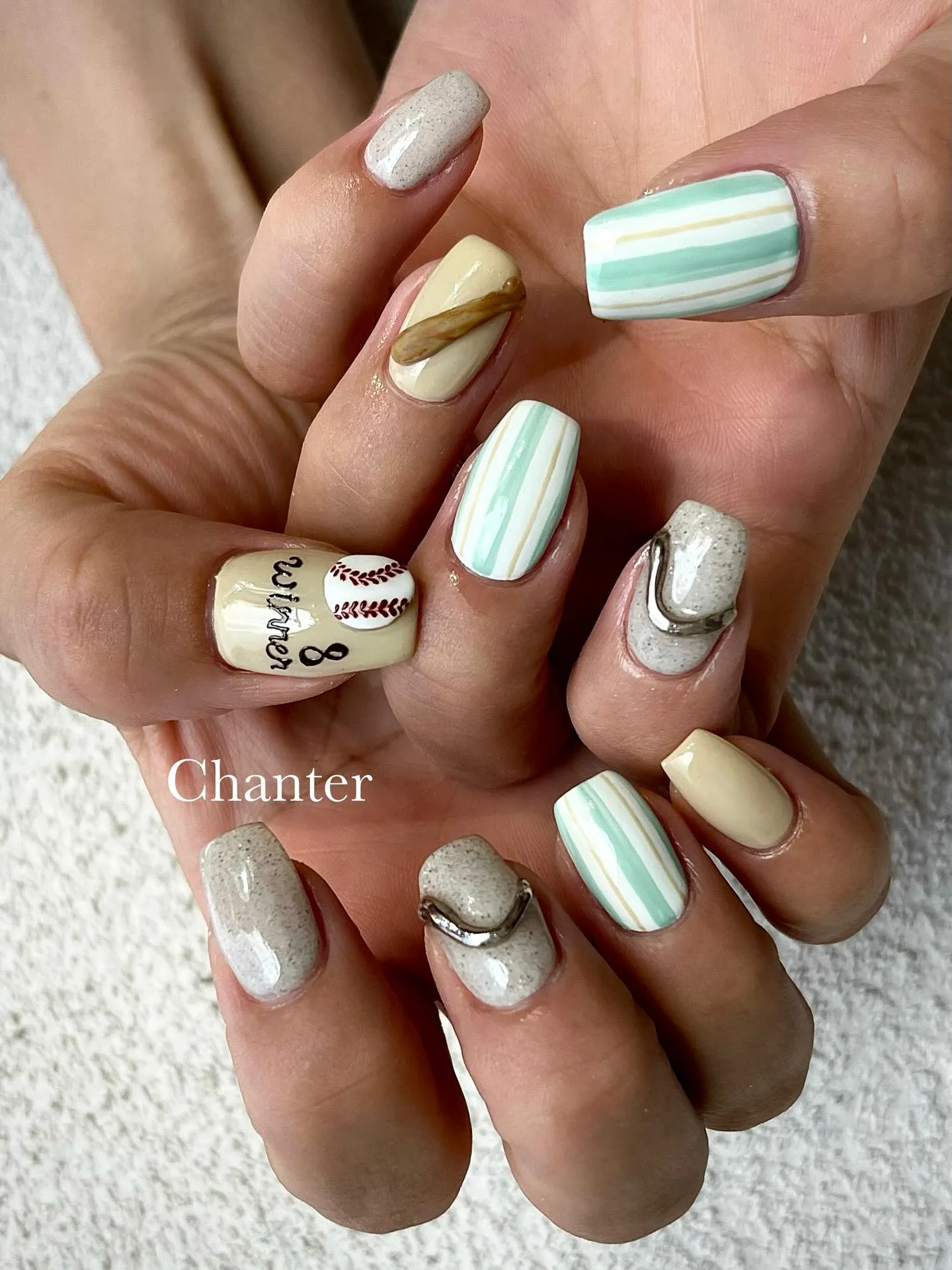 cream oval mixed pattern nails