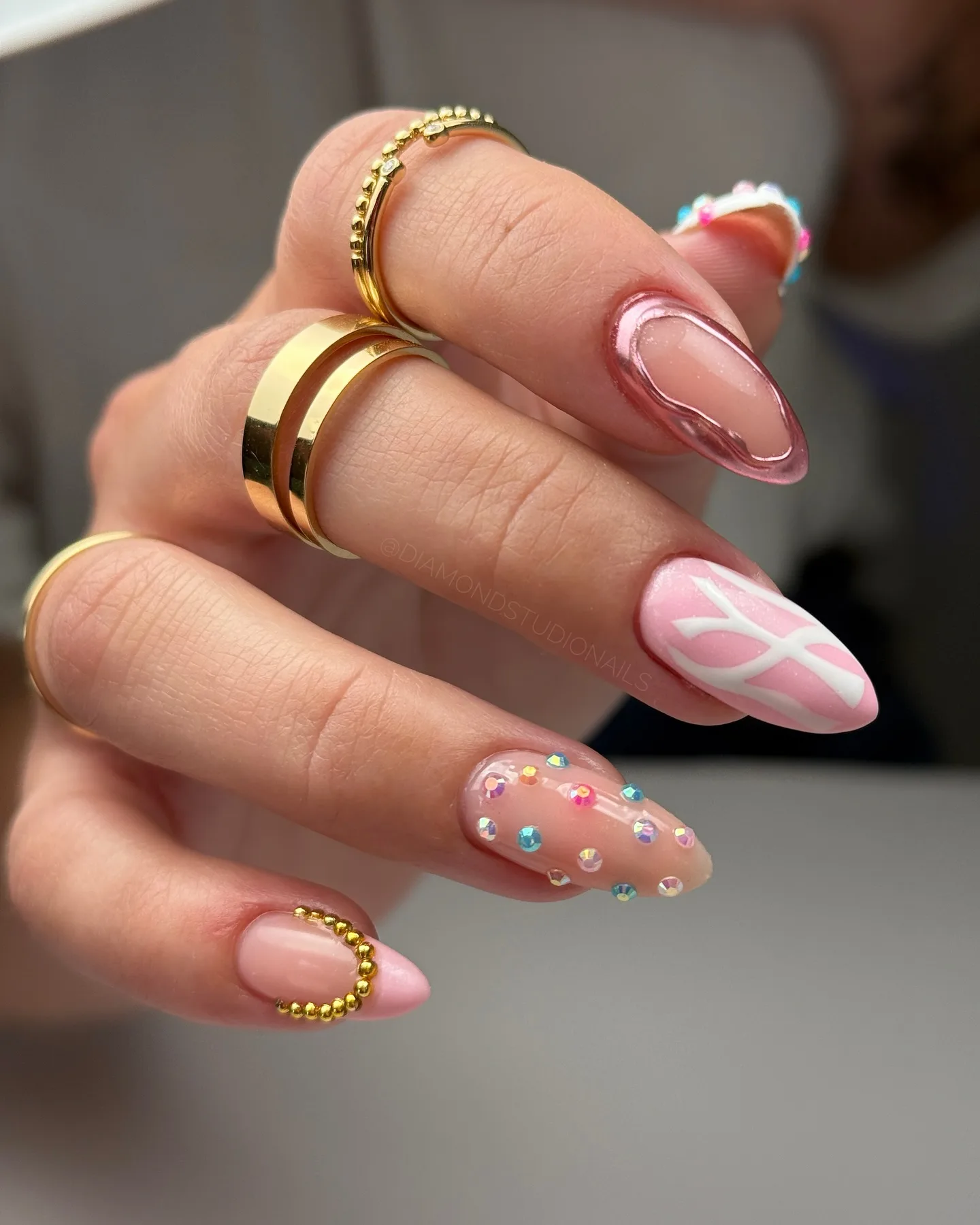 pink almond glossy embellished nails