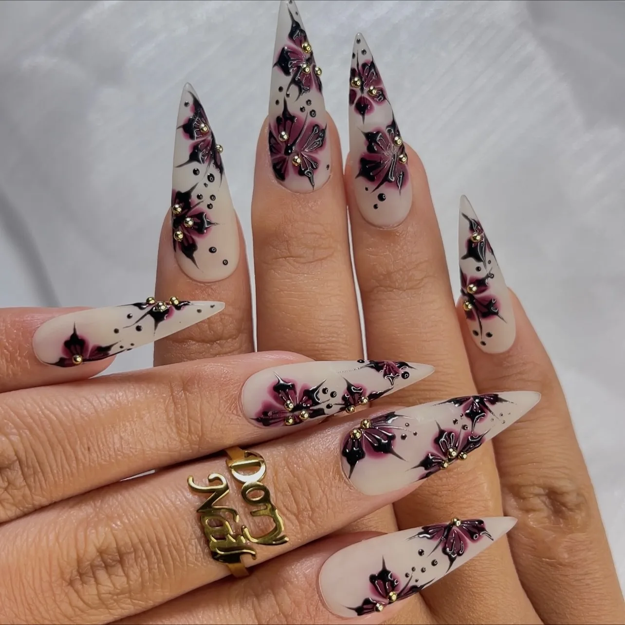 translucent stiletto burgundy floral nails