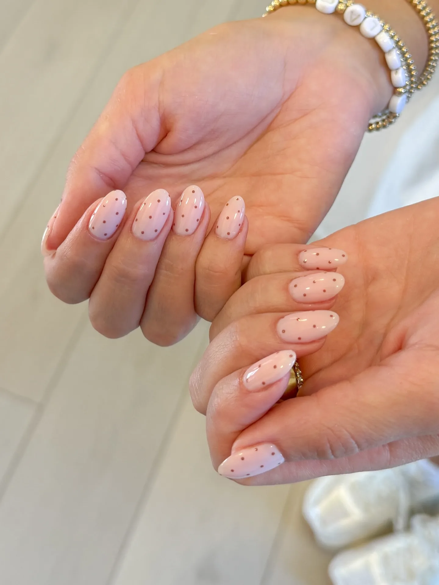 peachy pink oval dotted nails
