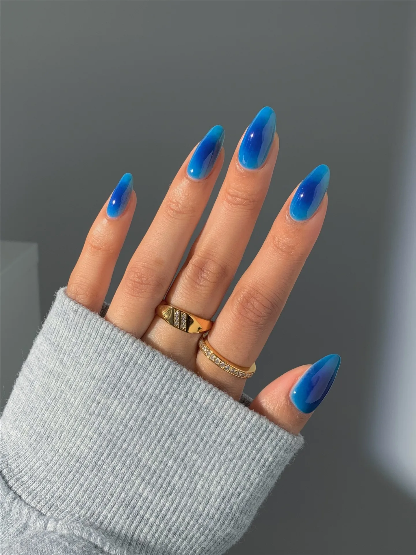 electric blue almond glossy nails