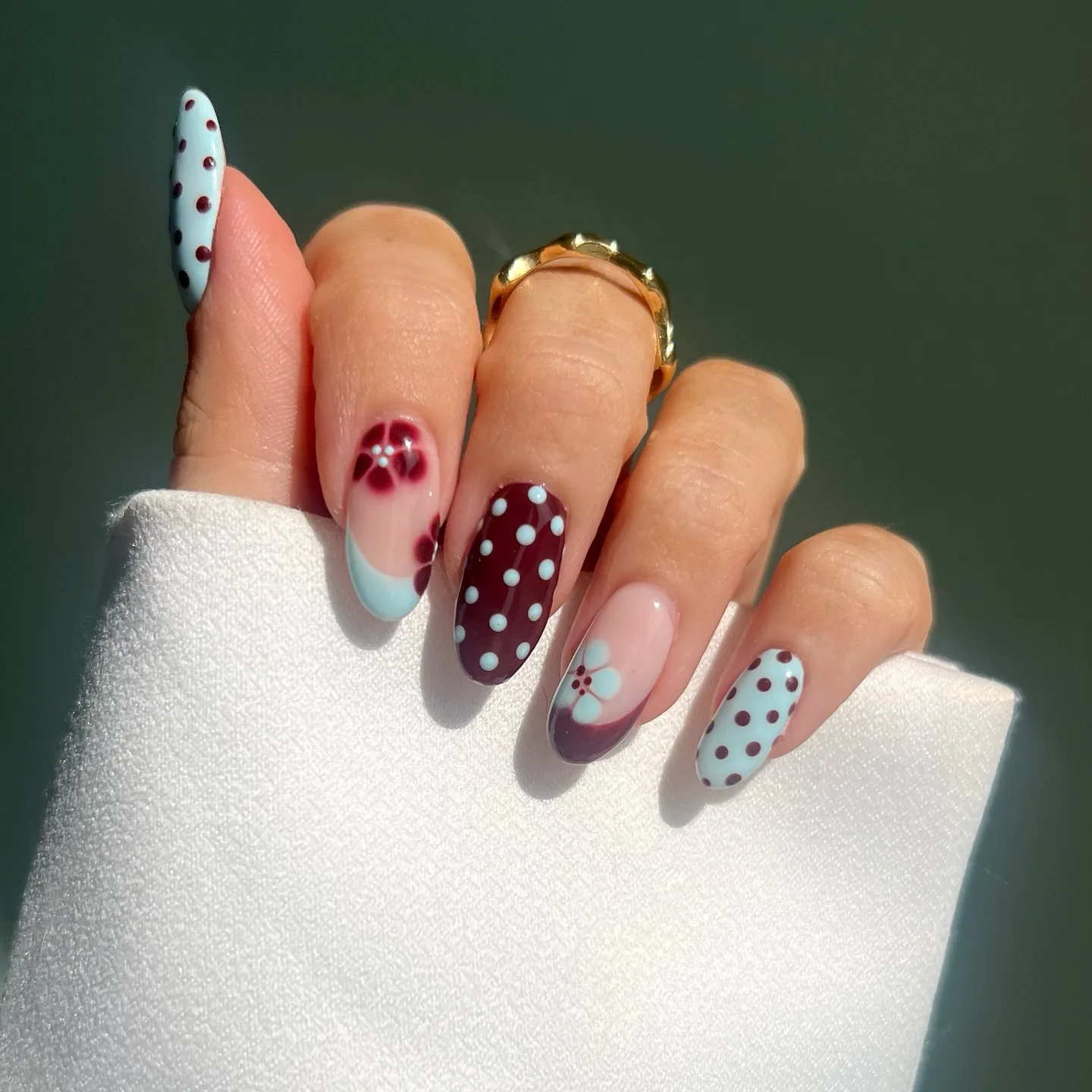 burgundy almond polka dot nails