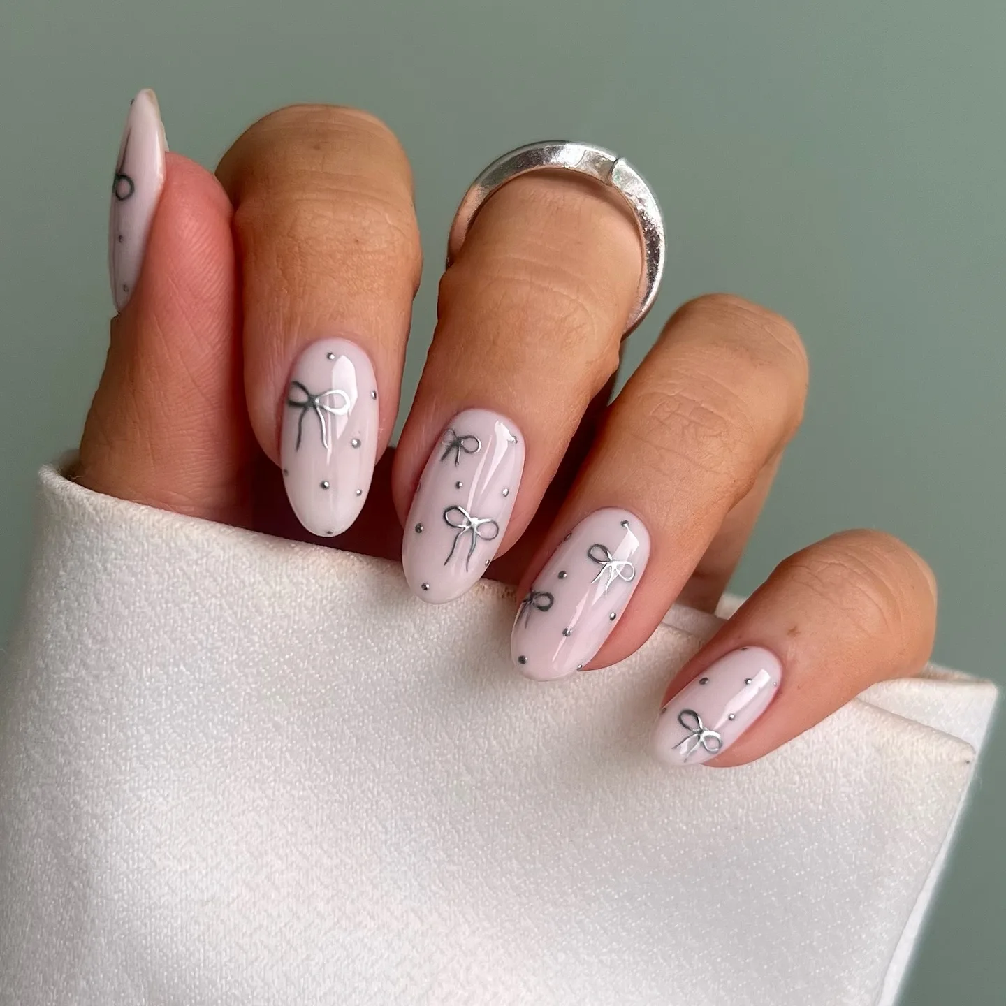 pink oval bow design nails