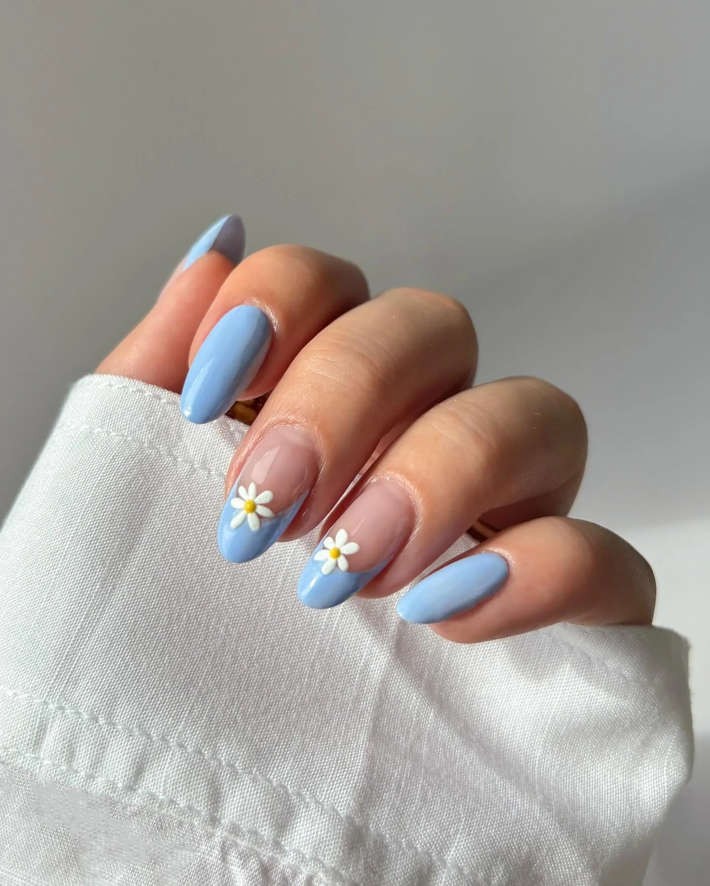 powder blue almond daisy nails