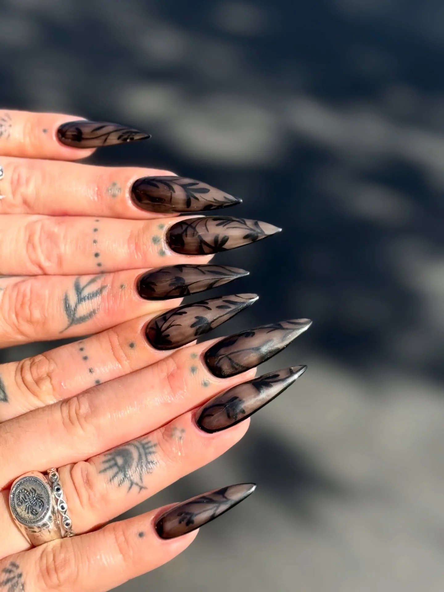 smoky brown stiletto botanical nails