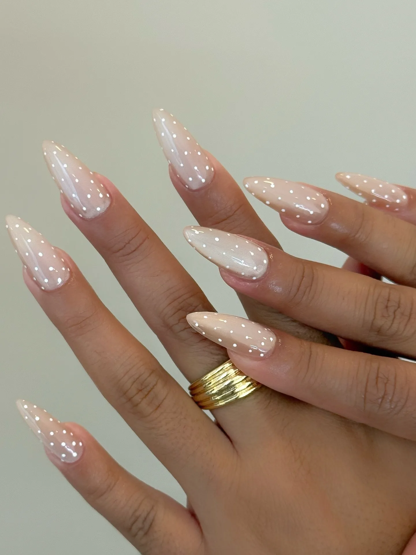 peachy nude almond polka dot nails