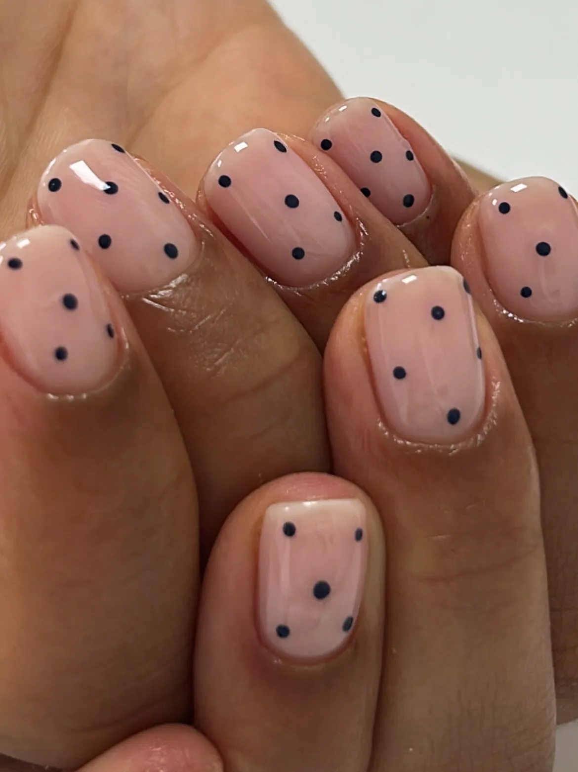 peachy nude rounded polka dot nails