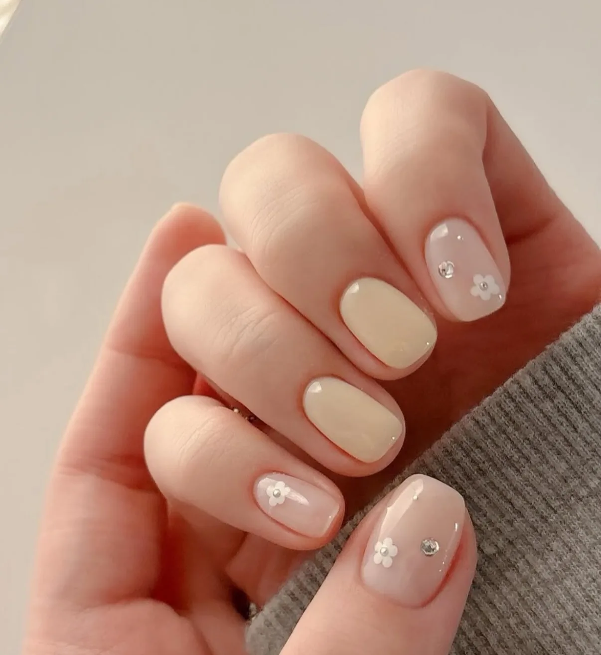 beige nude rounded rhinestone nails