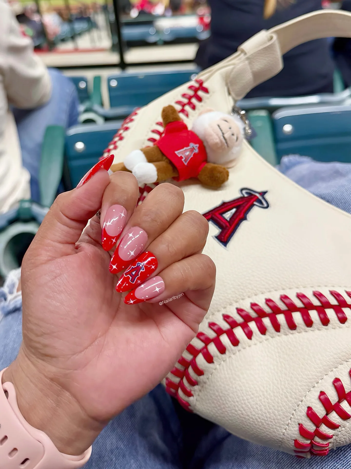 red almond glossy team logo nails
