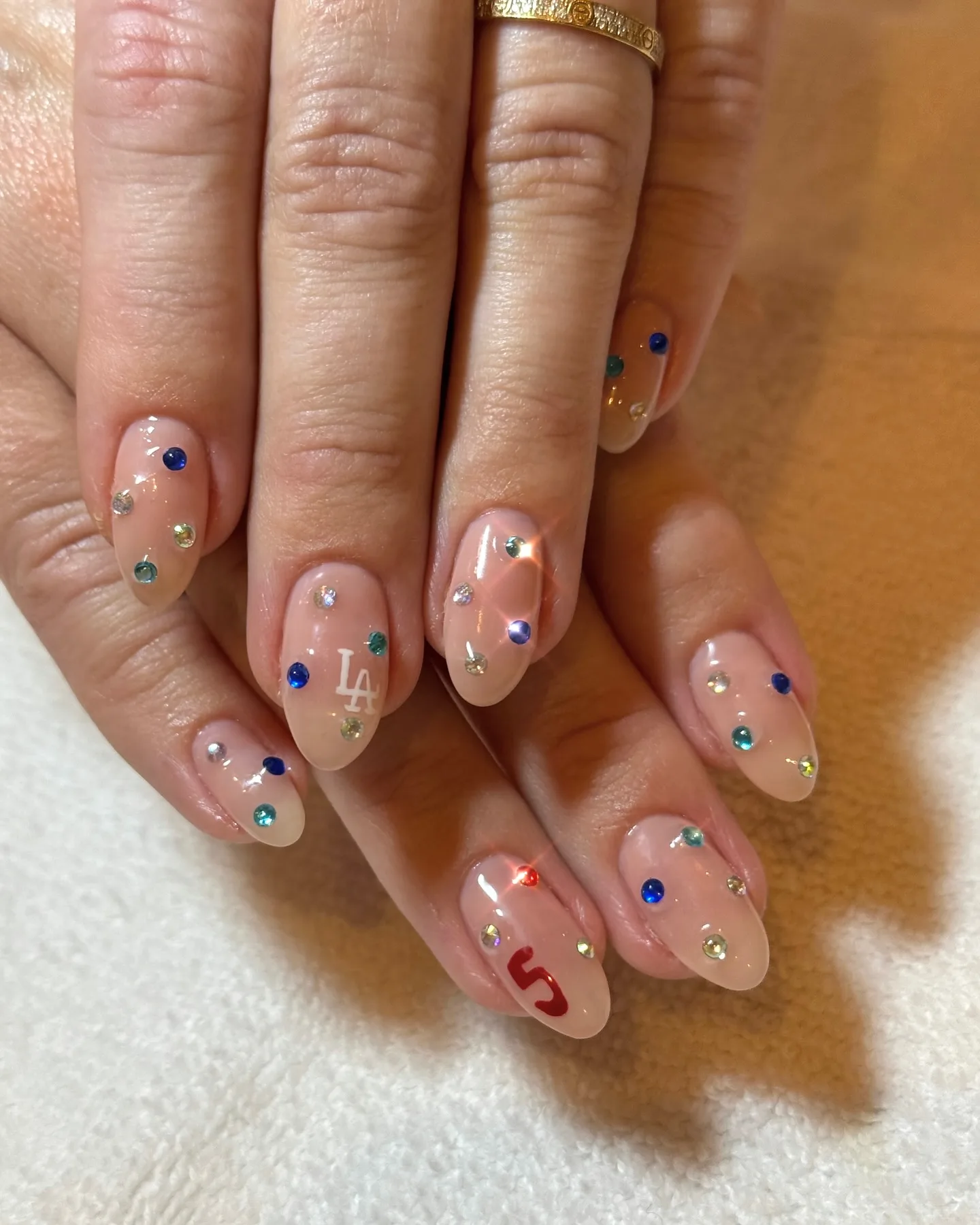 peachy nude almond glazed gem nails