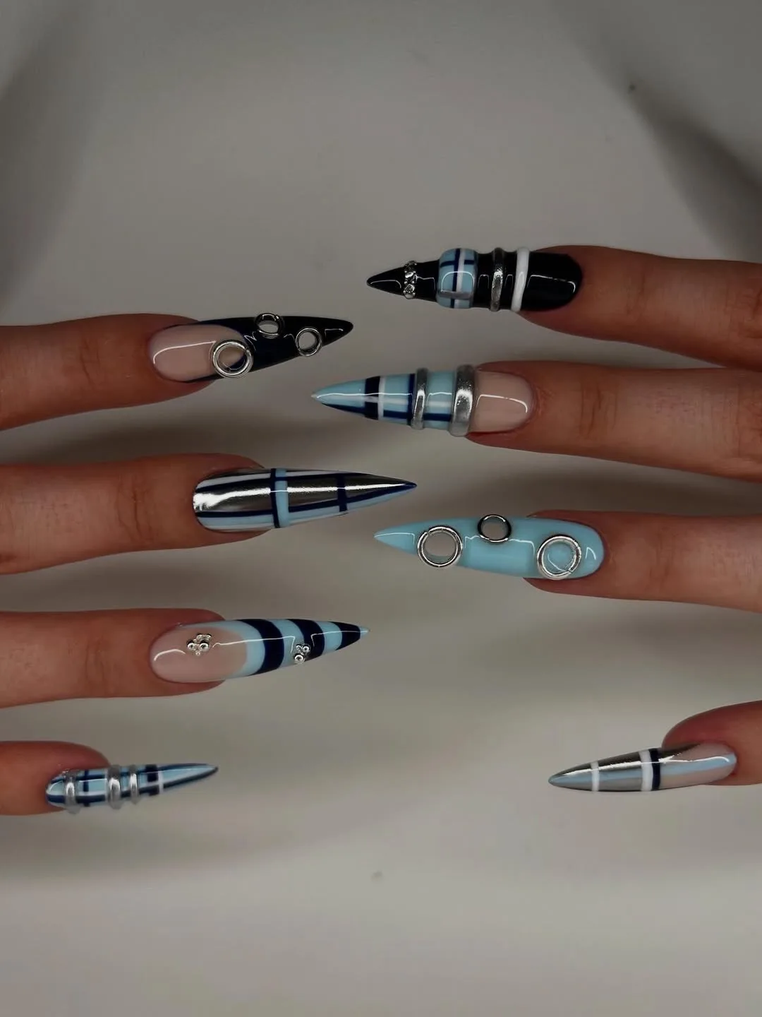 blue black stiletto embellished nails