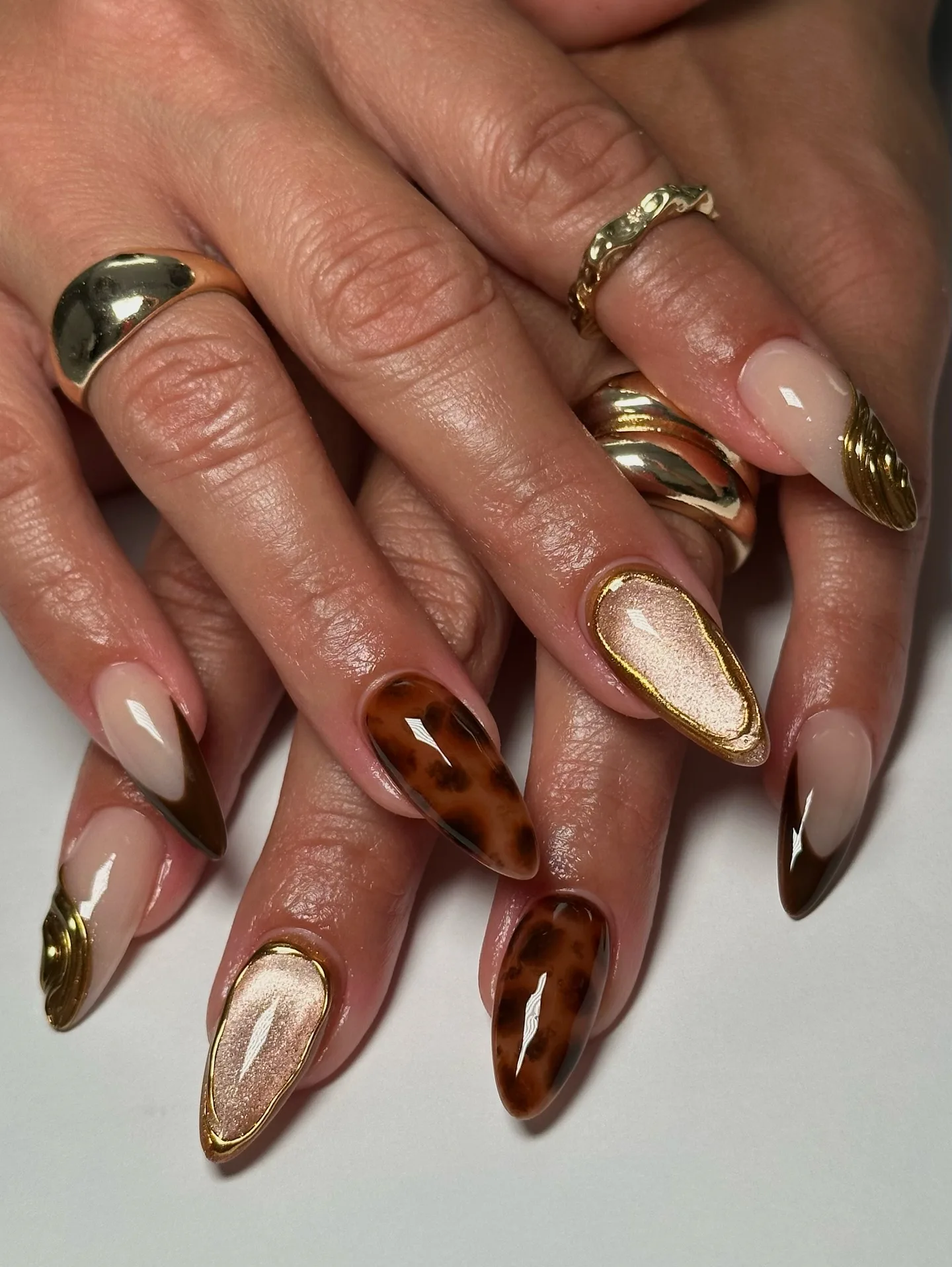 brown tortoiseshell almond chrome nails