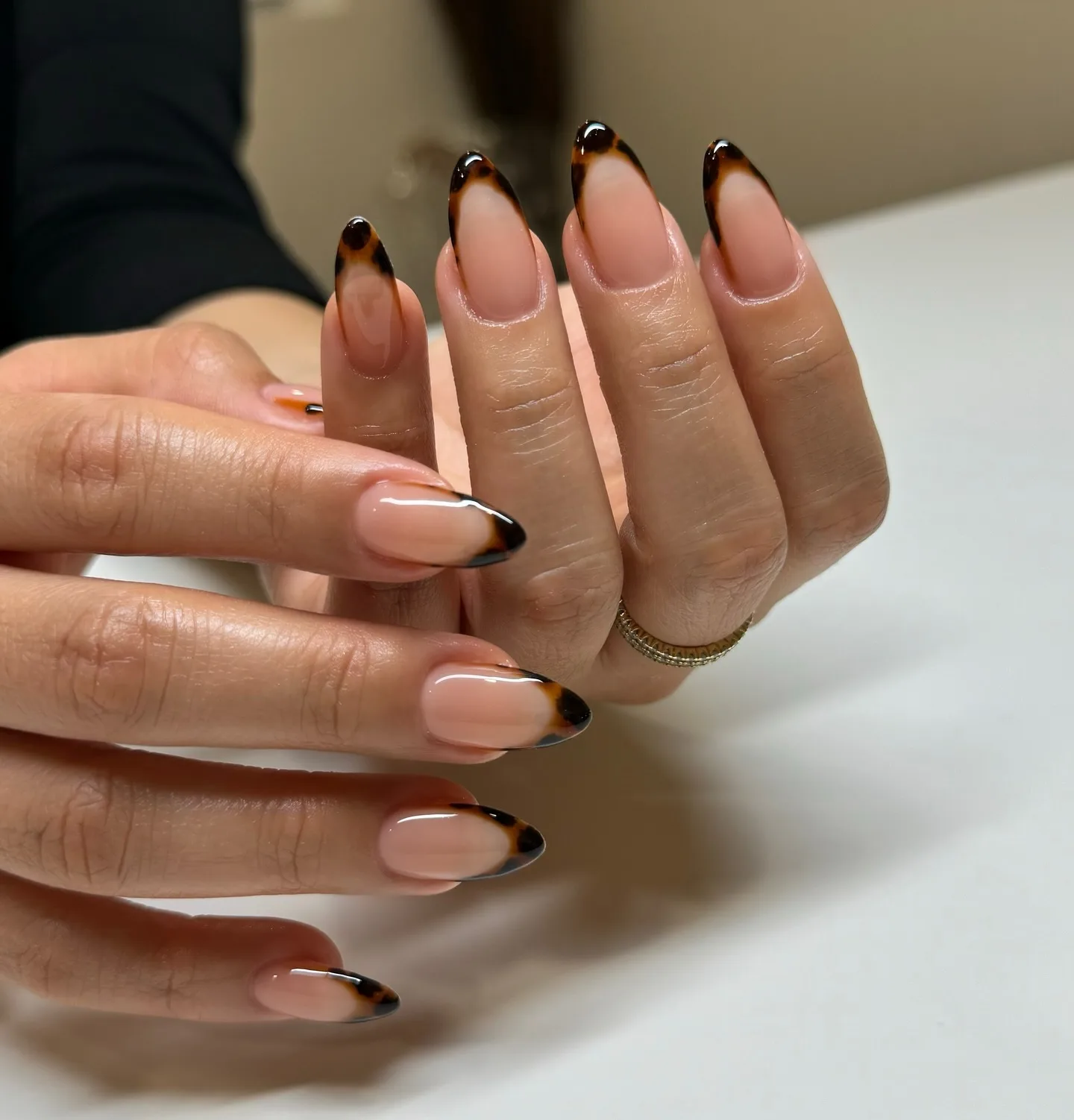 nude pink almond black tip nails