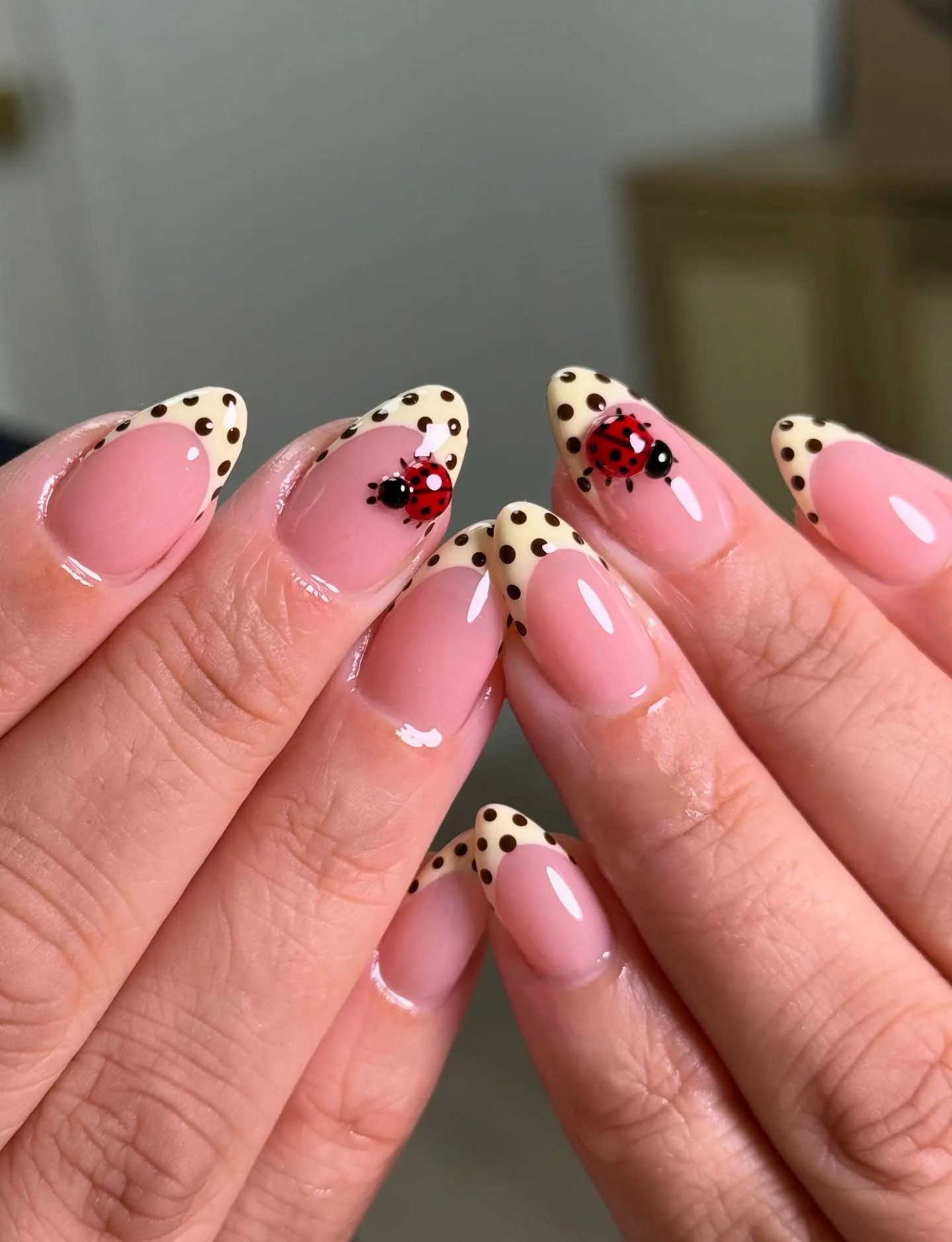 pink almond polka dot ladybug nails