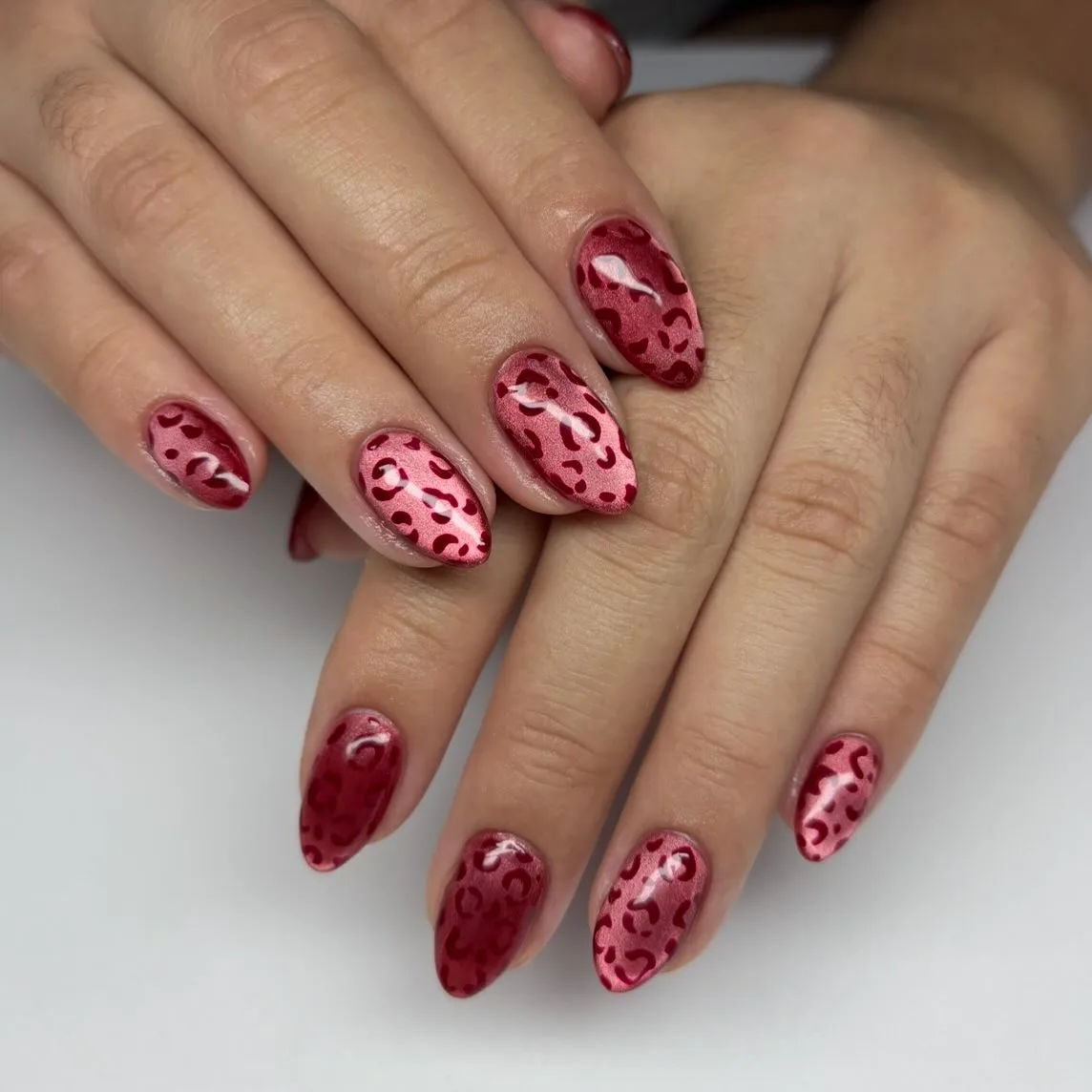 red almond leopard print nails