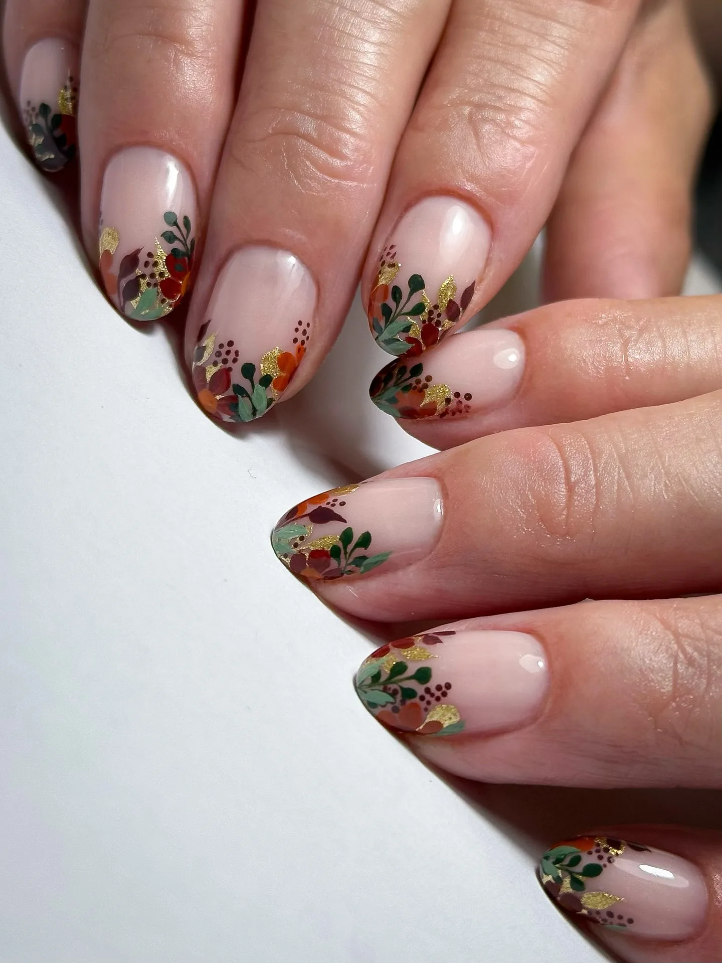 nude almond floral tip nails