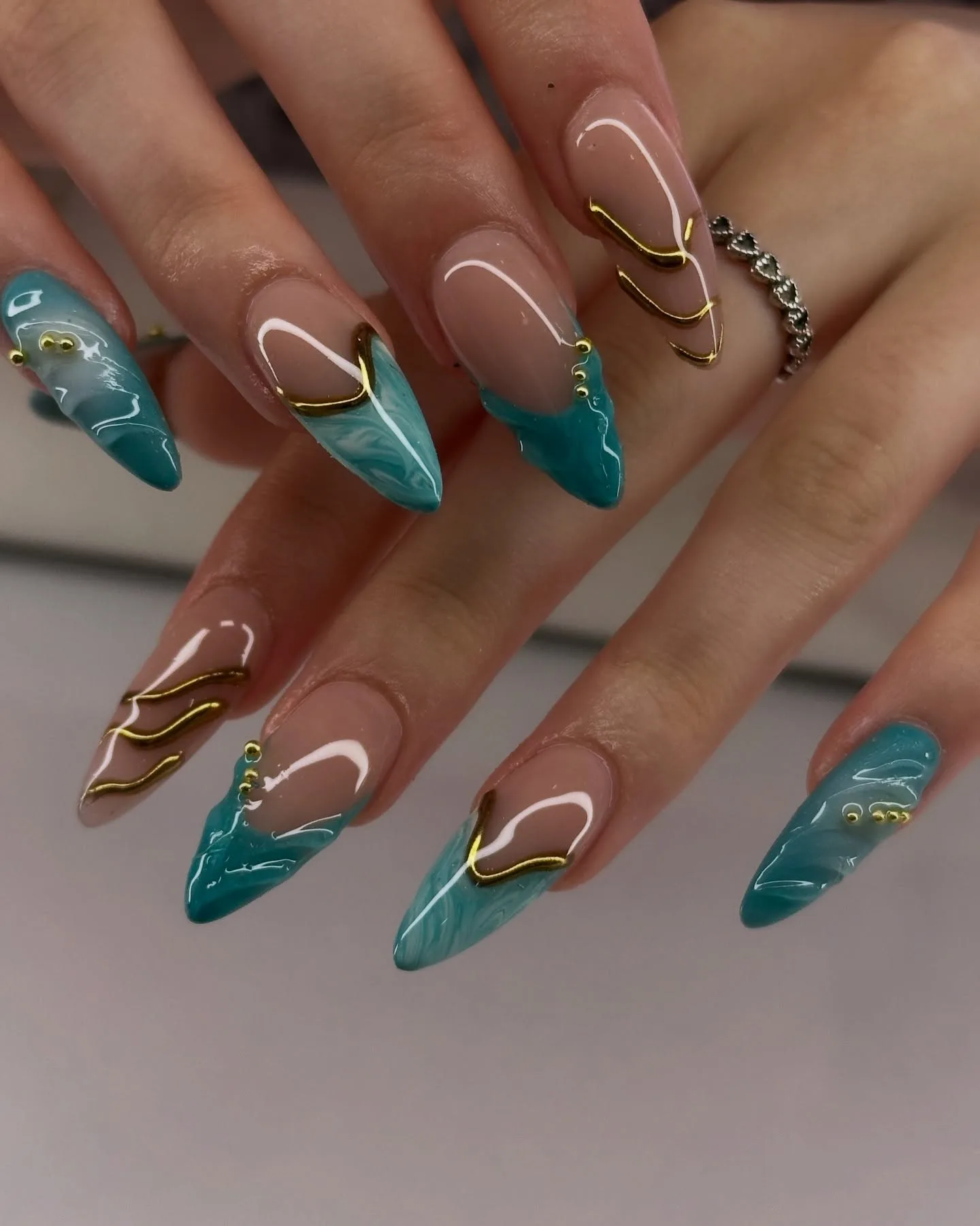 nude teal stiletto marble nails