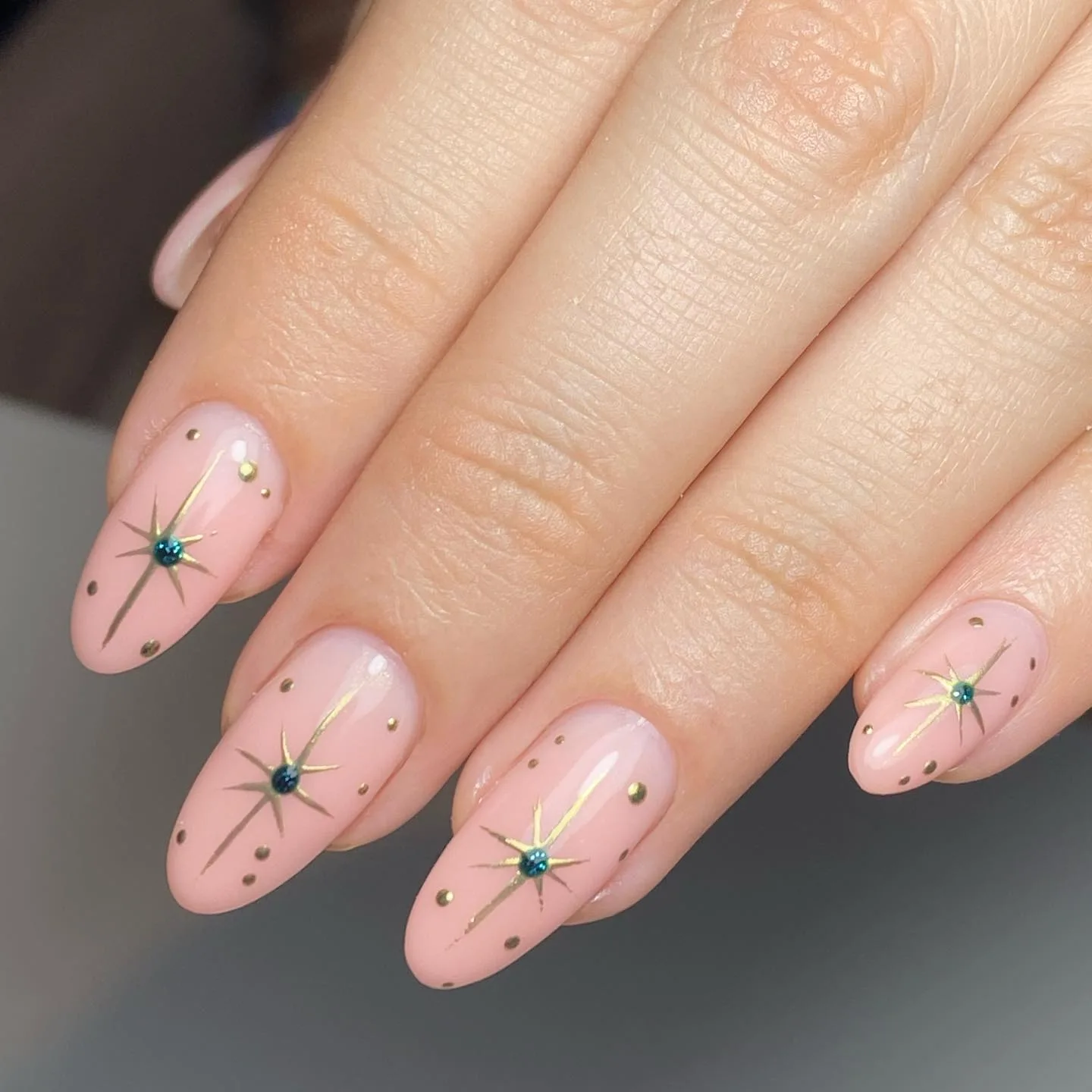 pink oval starburst rhinestone nails