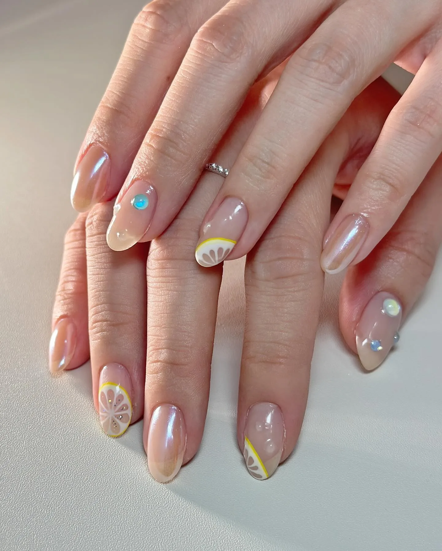 nude almond chrome lemon nails