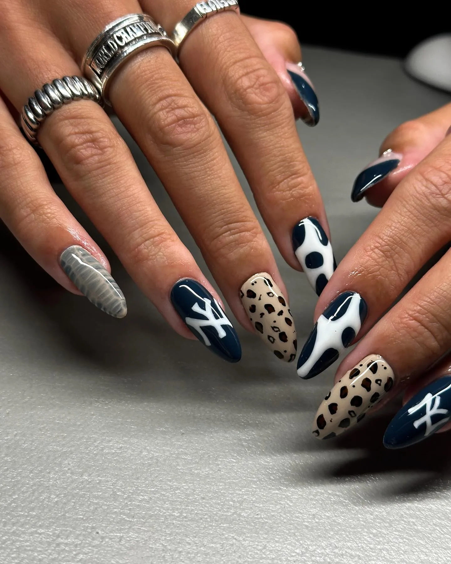 navy almond mixed pattern nails