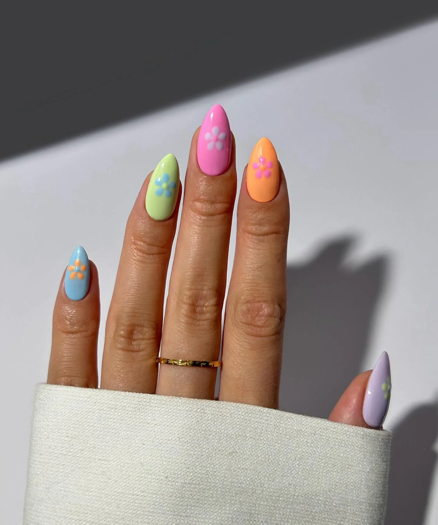 neon almond floral daisy nails